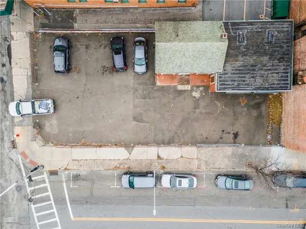 an aerial view of a livingroom with chairs