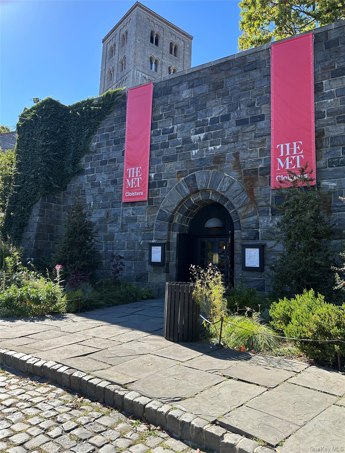295 Bennett Avenue, Unit 4B Manhattan, NY 10040 - Photo 13 of 18 a front view of a house with plants