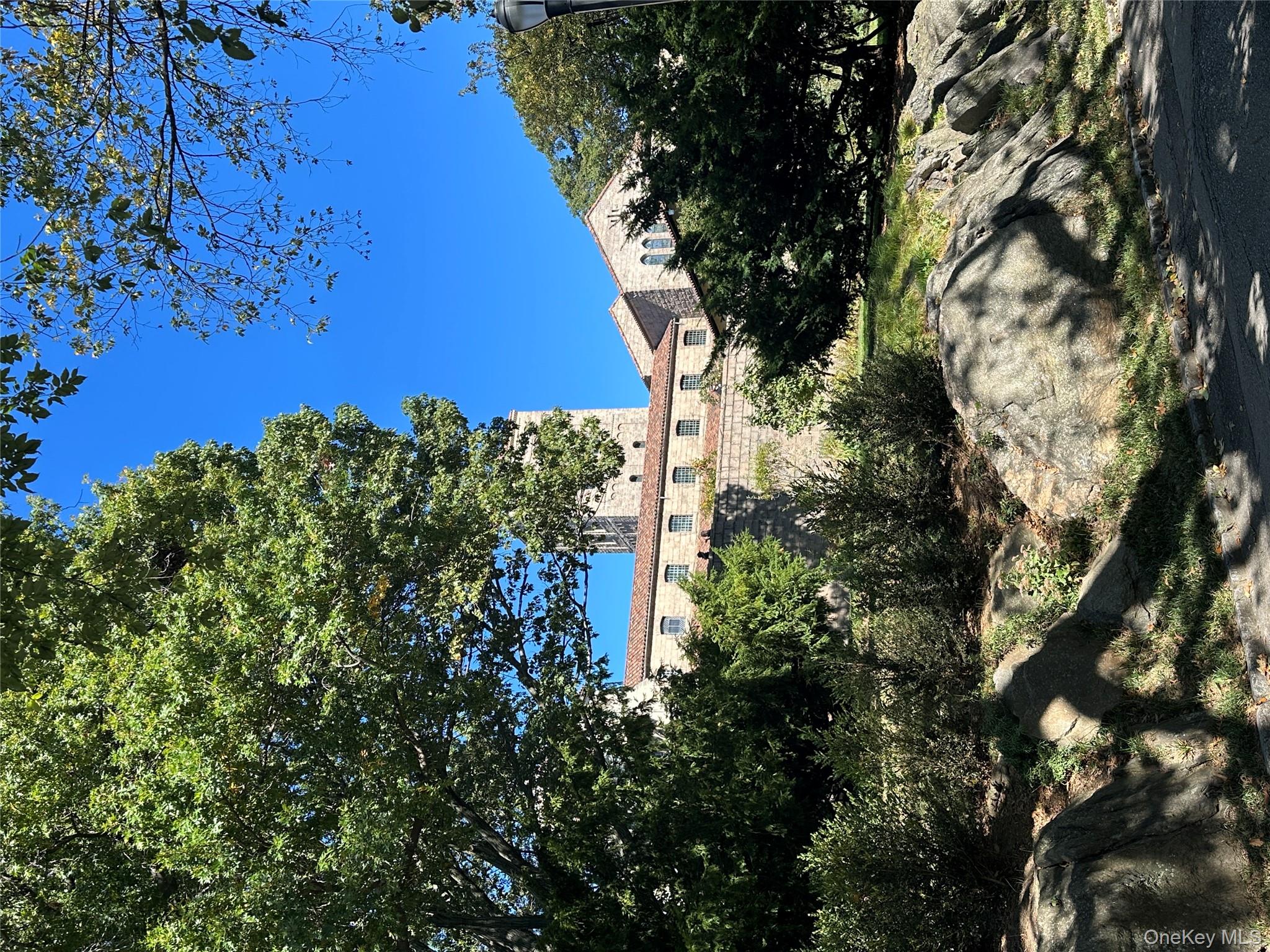 295 Bennett Avenue, Unit 4B Manhattan, NY 10040 - Photo 17 of 18 a view of a tree with a yard