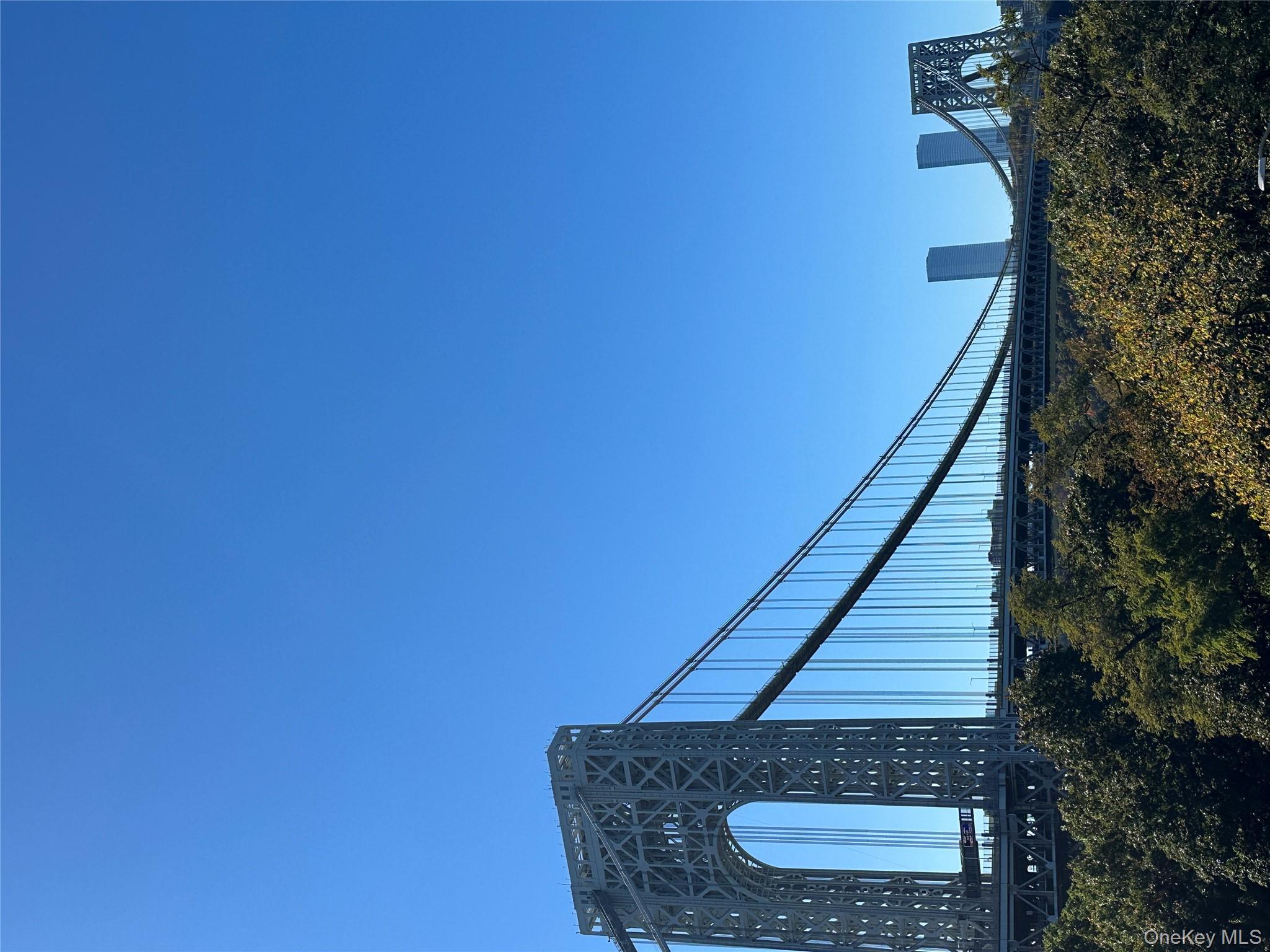 295 Bennett Avenue, Unit 4B Manhattan, NY 10040 - Photo 18 of 18 a view of a backyard with plants and wooden fence