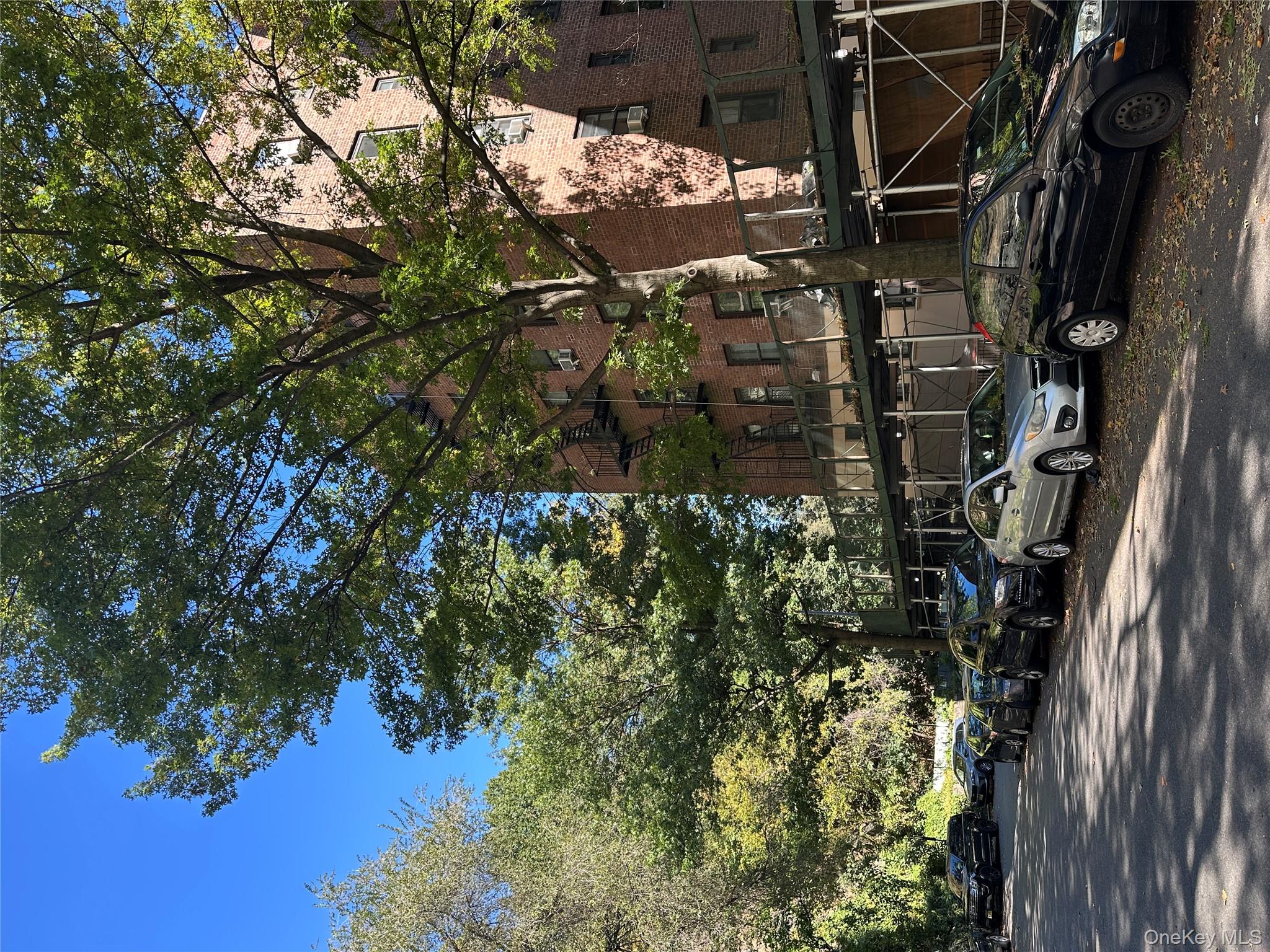 295 Bennett Avenue, Unit 4B Manhattan, NY 10040 - Photo 2 of 18 a car parked on the side of a street
