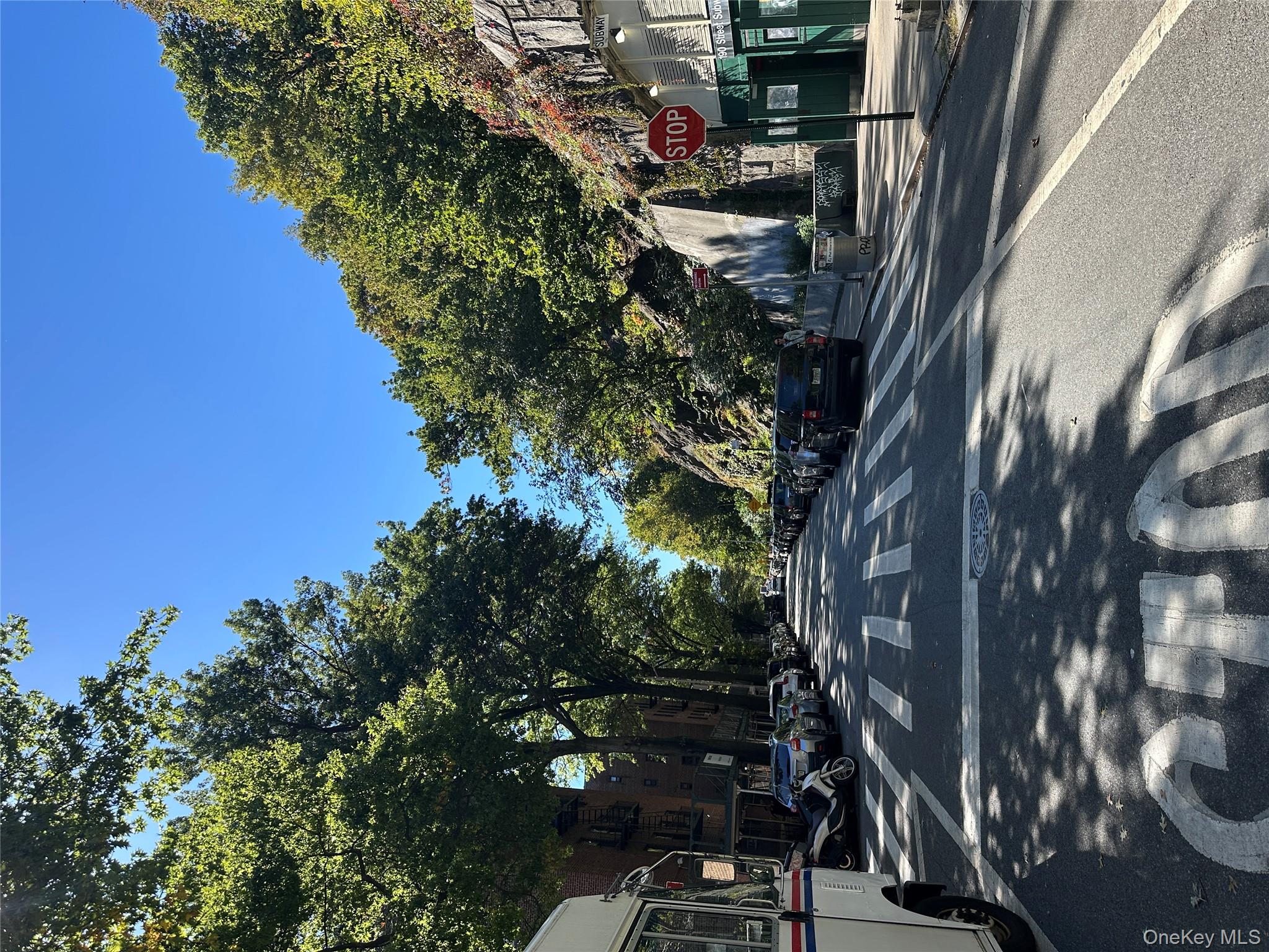 295 Bennett Avenue, Unit 4B Manhattan, NY 10040 - Photo 3 of 18 a view of street with houses