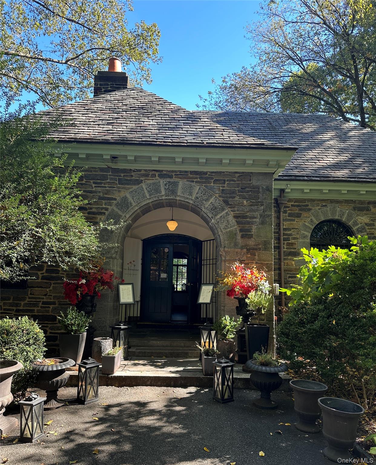 295 Bennett Avenue, Unit 4B Manhattan, NY 10040 - Photo 10 of 18 a front view of a house with outdoor seating