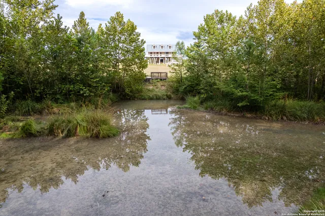 a view of a lake view with houses in back