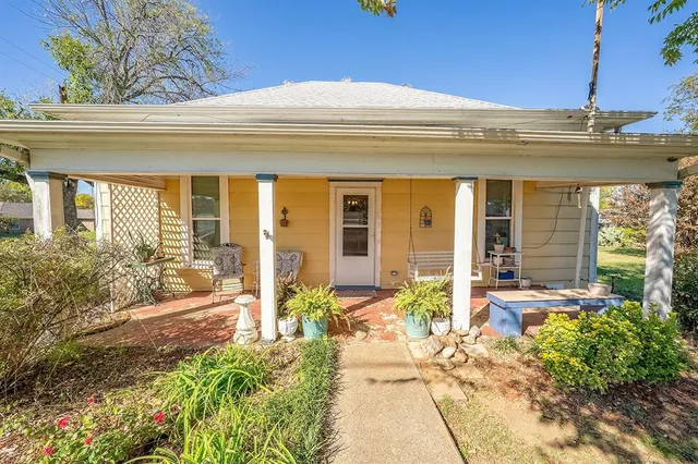 a view of a house with outdoor seating