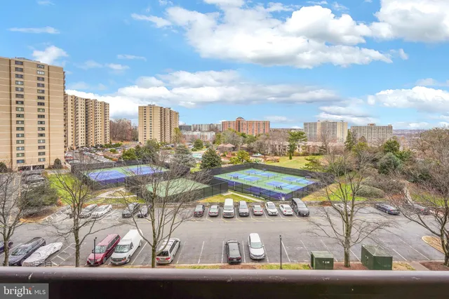 a bathroom with a double vanity sink mirror and shower
