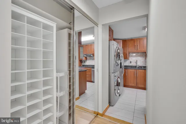 a view of walk in closet with empty racks
