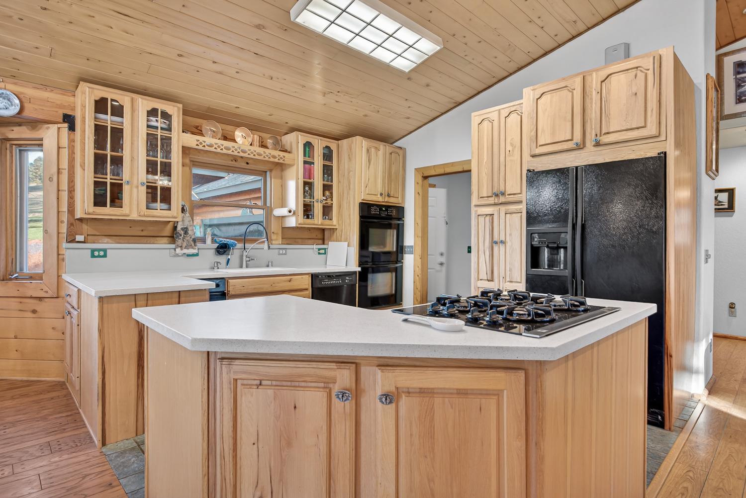 10394 Ponderosa Way Mountain Ranch, CA 95246 - Photo 11 of 58 a kitchen with stainless steel appliances a sink stove and refrigerator