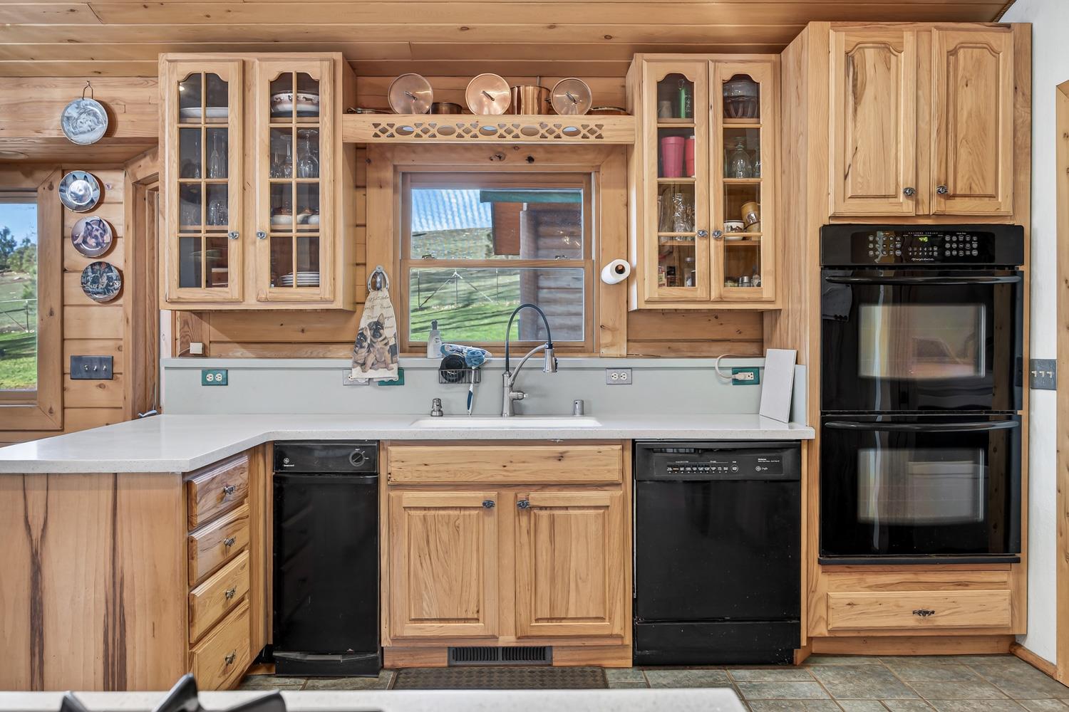 10394 Ponderosa Way Mountain Ranch, CA 95246 - Photo 12 of 58 a kitchen with stainless steel appliances granite countertop a stove and a microwave