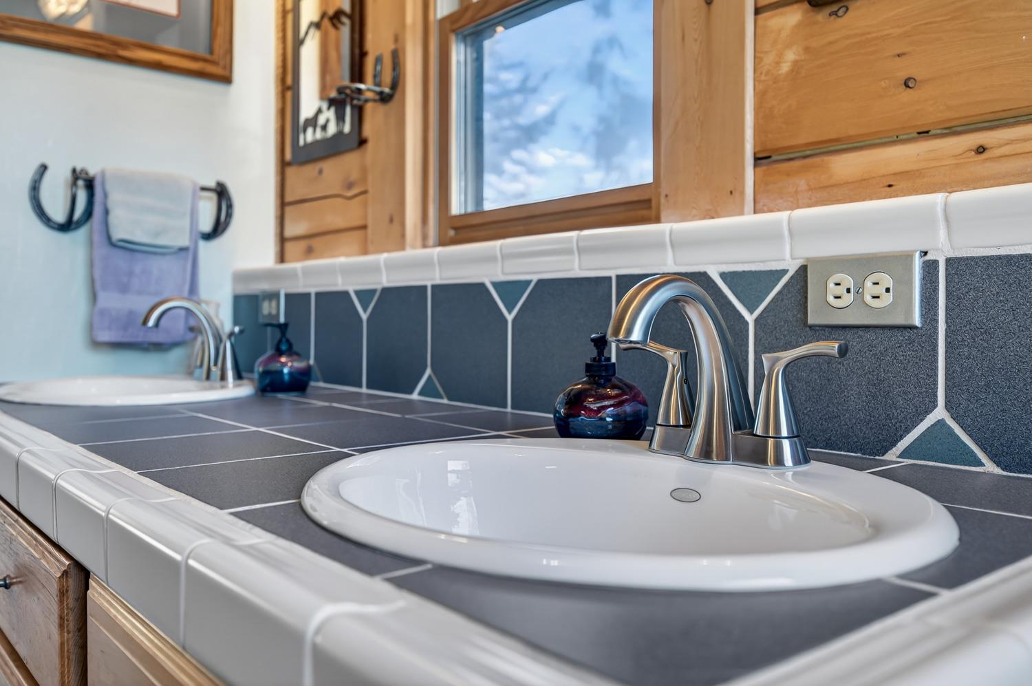 10394 Ponderosa Way Mountain Ranch, CA 95246 - Photo 22 of 58 a picture of a bathroom sink