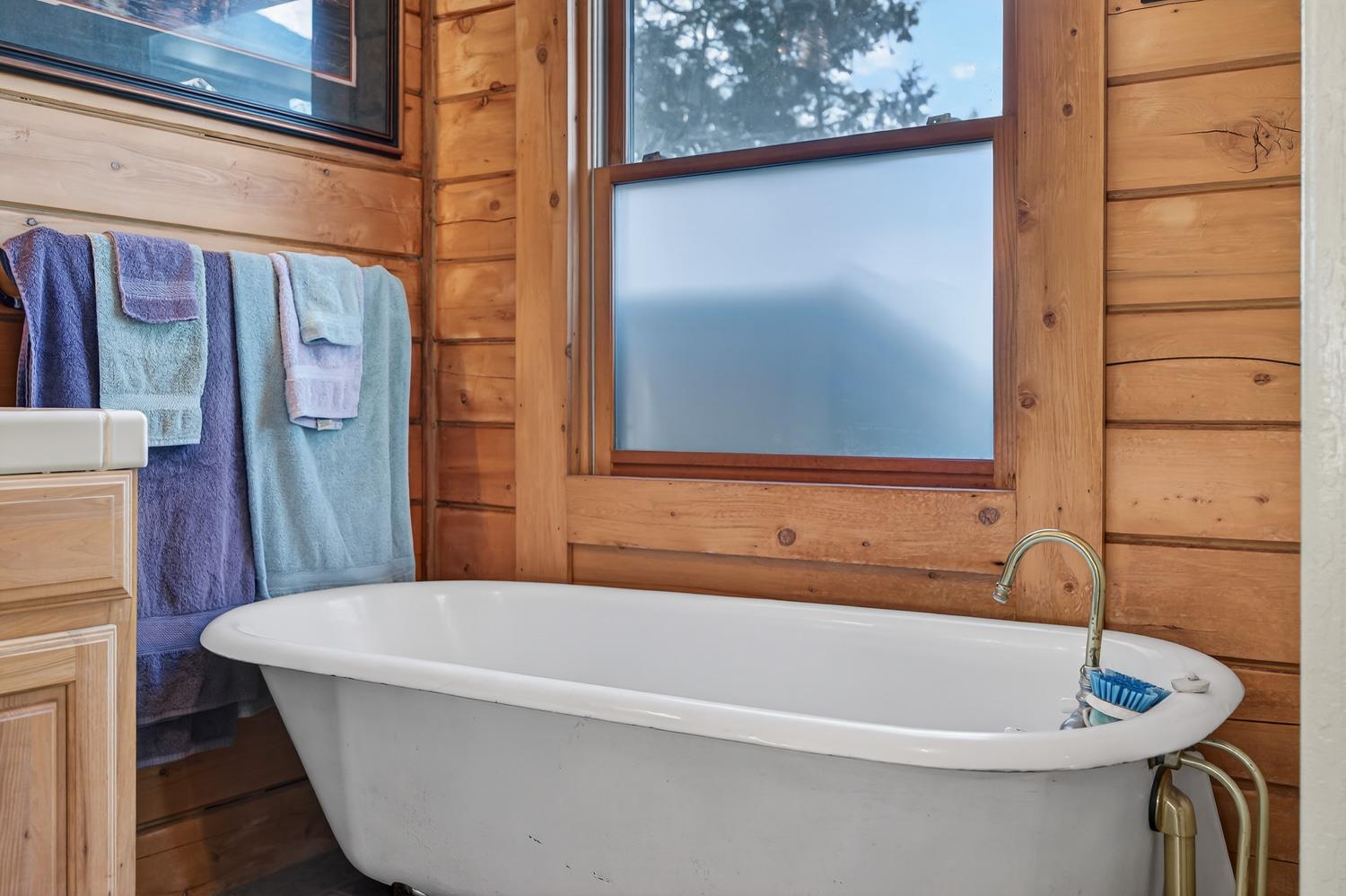 10394 Ponderosa Way Mountain Ranch, CA 95246 - Photo 23 of 58 a bathroom with a sink and a bathtub
