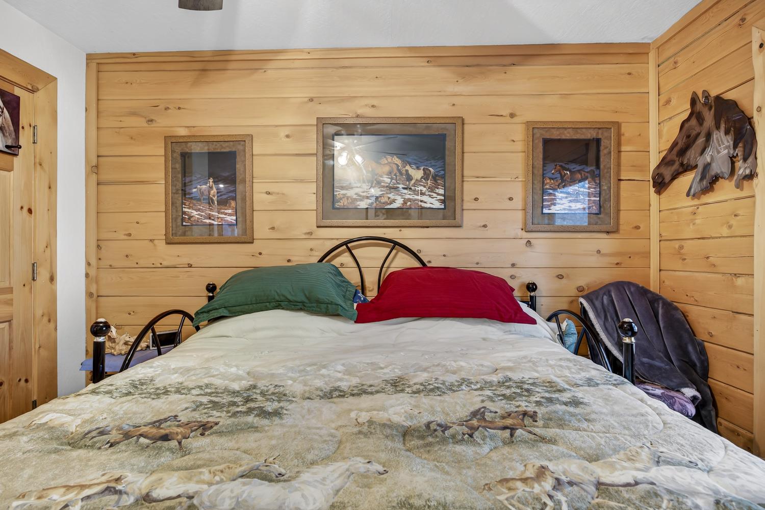 10394 Ponderosa Way Mountain Ranch, CA 95246 - Photo 29 of 58 a bedroom with a bed and a flat screen tv