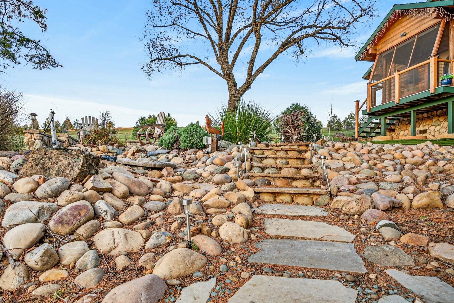 10394 Ponderosa Way Mountain Ranch, CA 95246 - Photo 36 of 58 a view of a pathway with a wrought fence