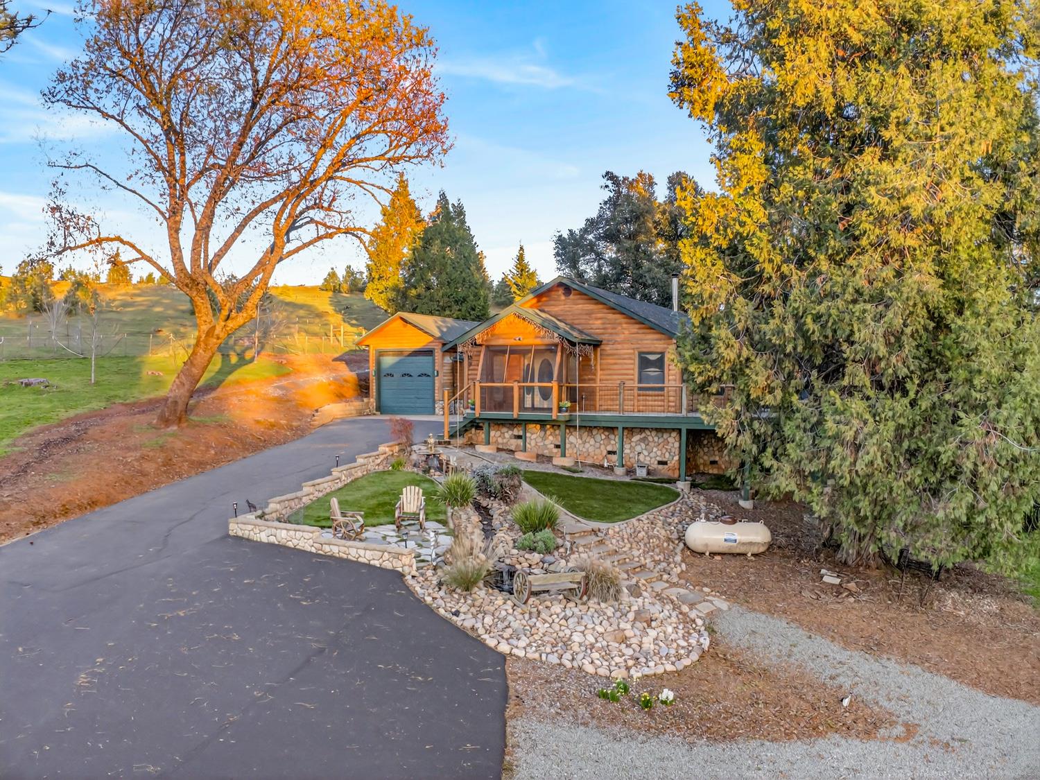 10394 Ponderosa Way Mountain Ranch, CA 95246 - Photo 41 of 58 a front view of a house with a yard