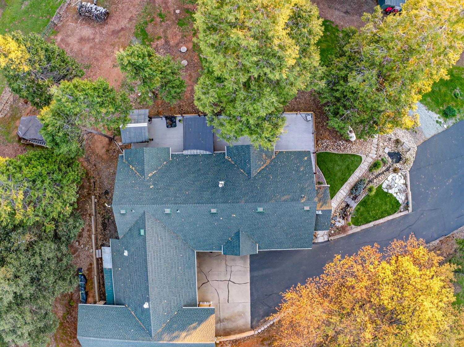 10394 Ponderosa Way Mountain Ranch, CA 95246 - Photo 42 of 58 an aerial view of a house with a yard and garden