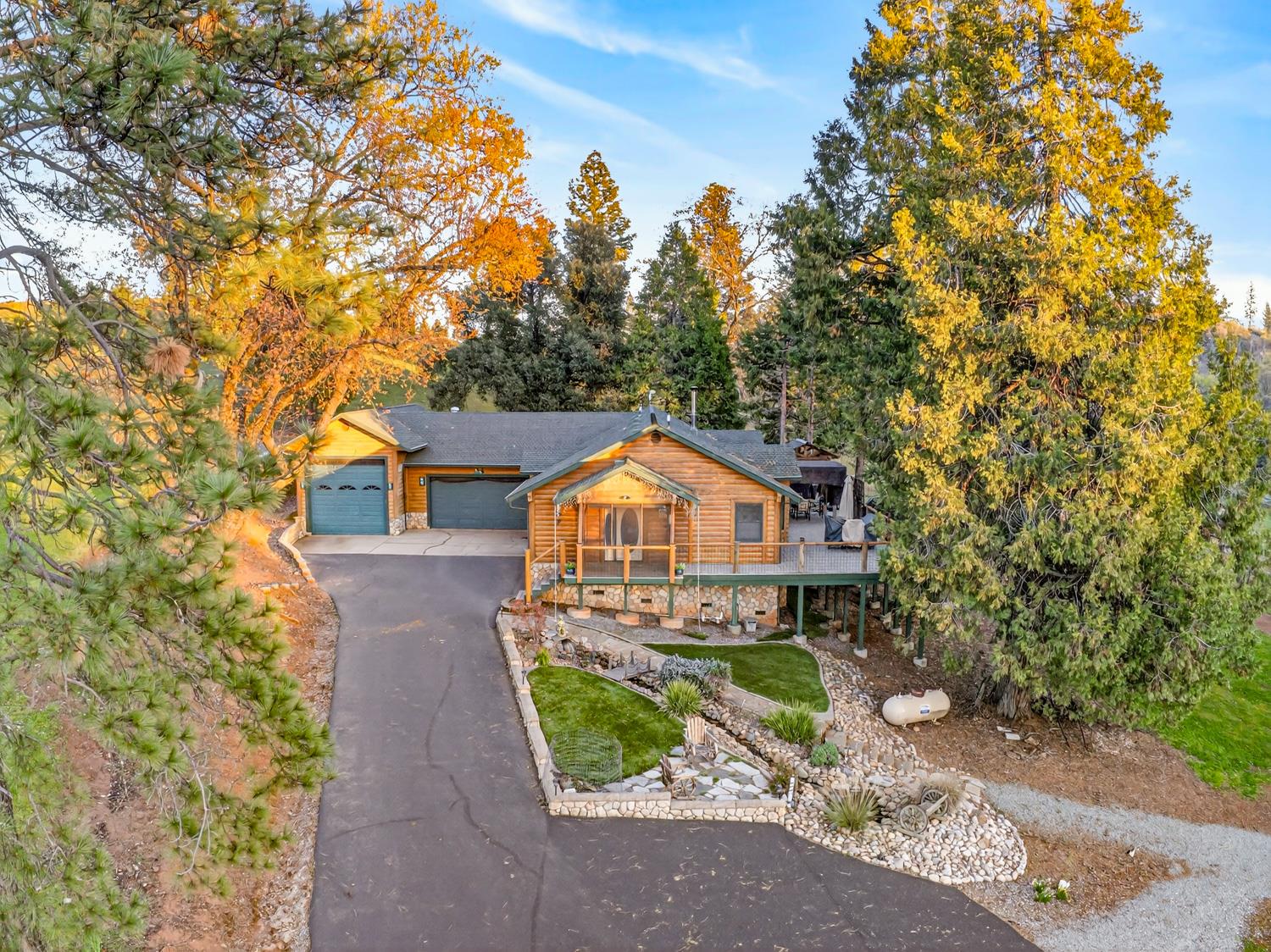 10394 Ponderosa Way Mountain Ranch, CA 95246 - Photo 43 of 58 a front view of a house with a yard