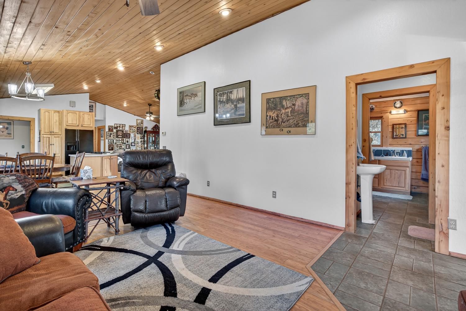 10394 Ponderosa Way Mountain Ranch, CA 95246 - Photo 6 of 58 a living room with furniture and view of kitchen