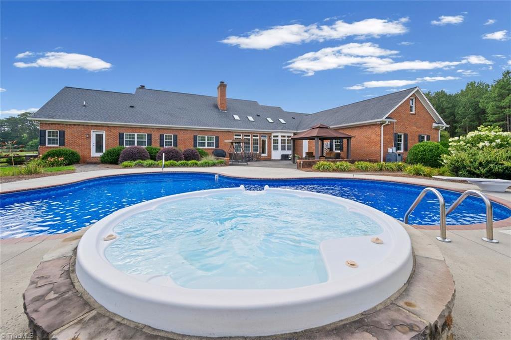 1044 Lasley Road Lewisville, NC 27023 - Photo 38 of 50 Sparkling salt water pool with heater and spa perfect for summer days and evenings