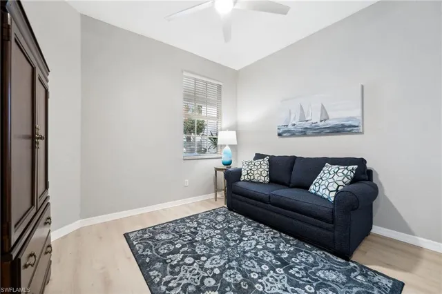 a living room with a couch and a rug