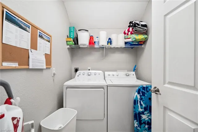 a utility room with dryer washer and shoe rack