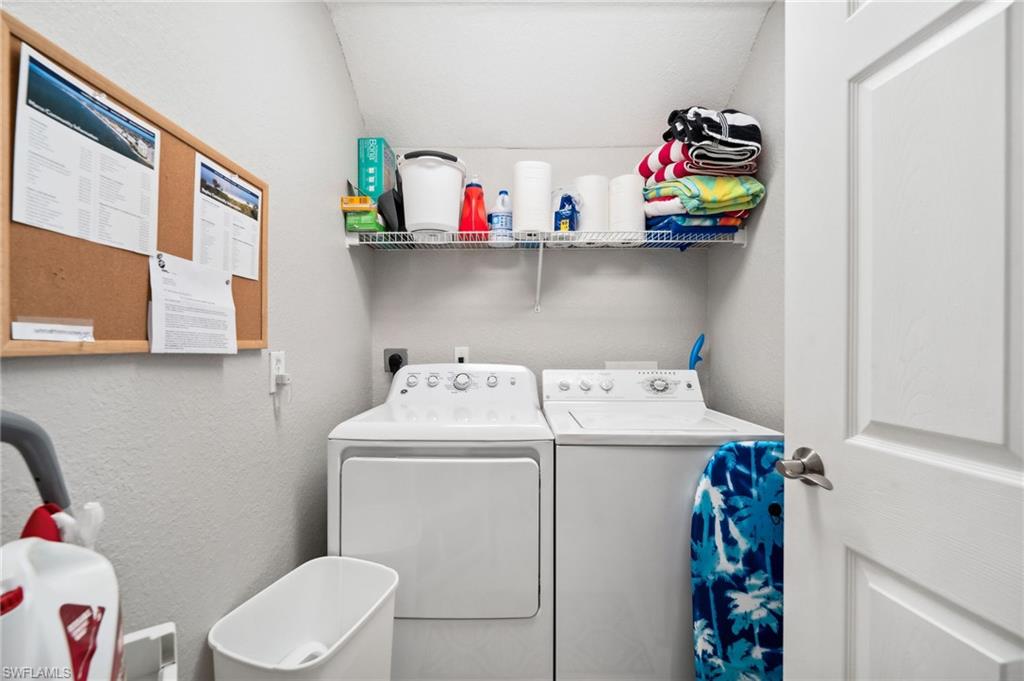 8355 Whisper Trace Lane, Unit K104 Naples, FL 34114 - Photo 13 of 21 a utility room with dryer washer and shoe rack