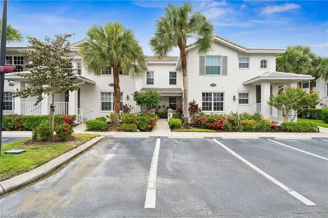 an aerial view of a house with swimming pool and garden
