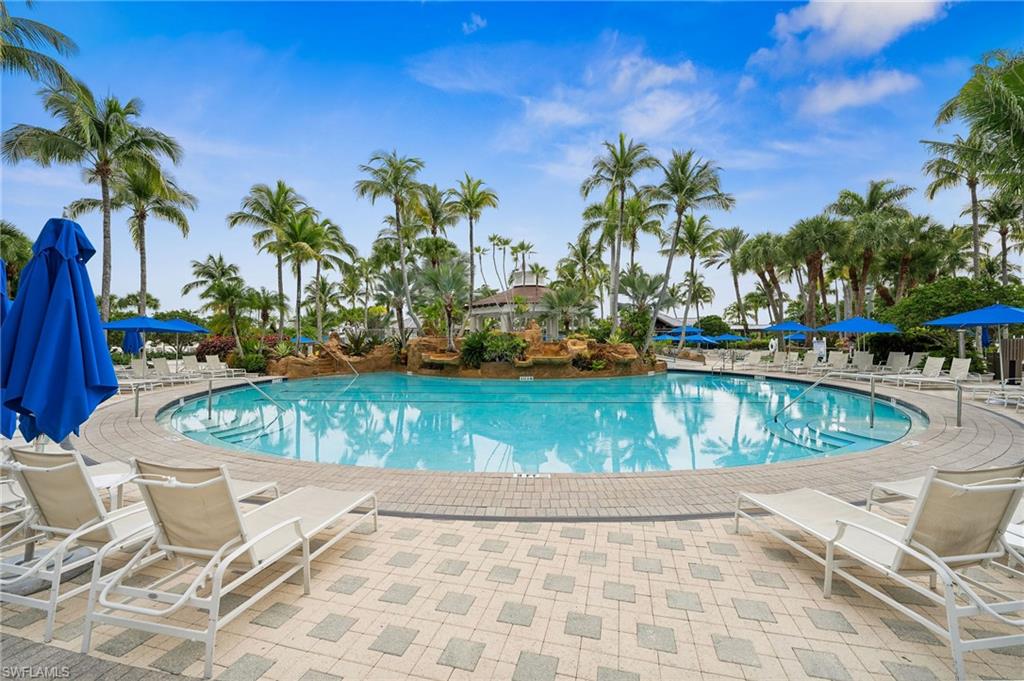 8355 Whisper Trace Lane, Unit K104 Naples, FL 34114 - Photo 19 of 21 a view of a swimming pool with a patio