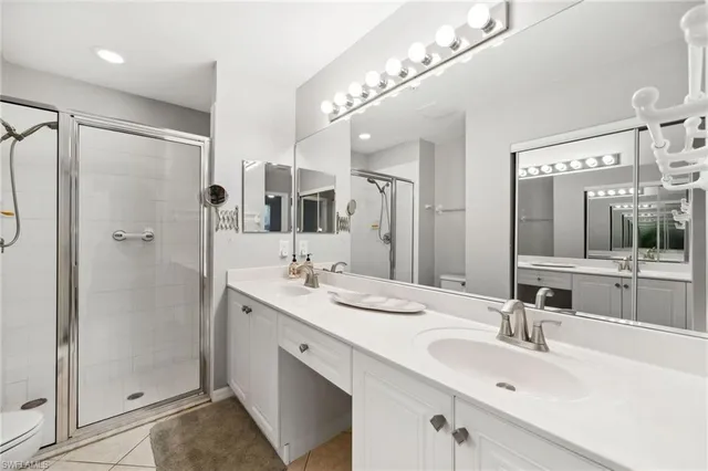 a bathroom with a double vanity sink mirror and double