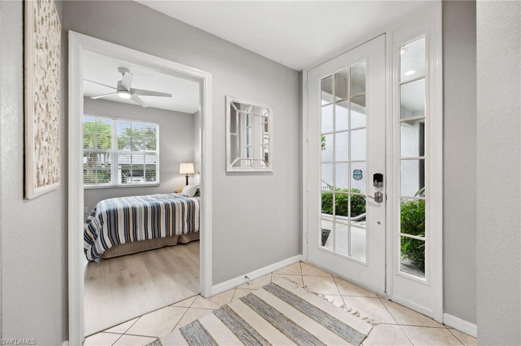 8355 Whisper Trace Lane, Unit K104 Naples, FL 34114 - Photo 10 of 21 a view of an entryway with a livingroom