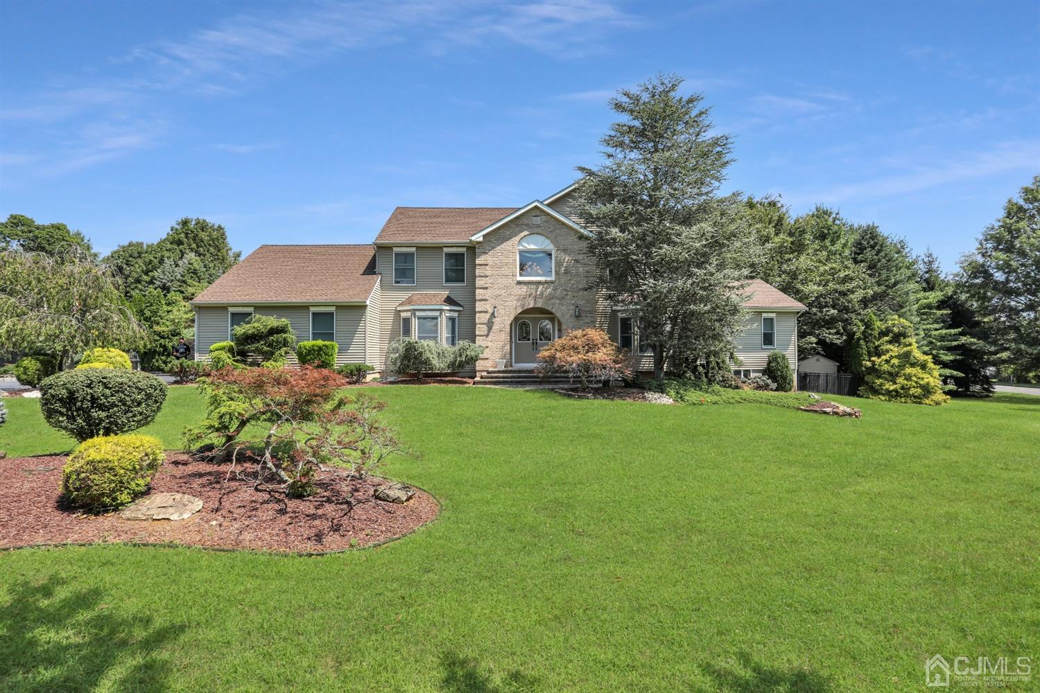 a front view of a house with a yard