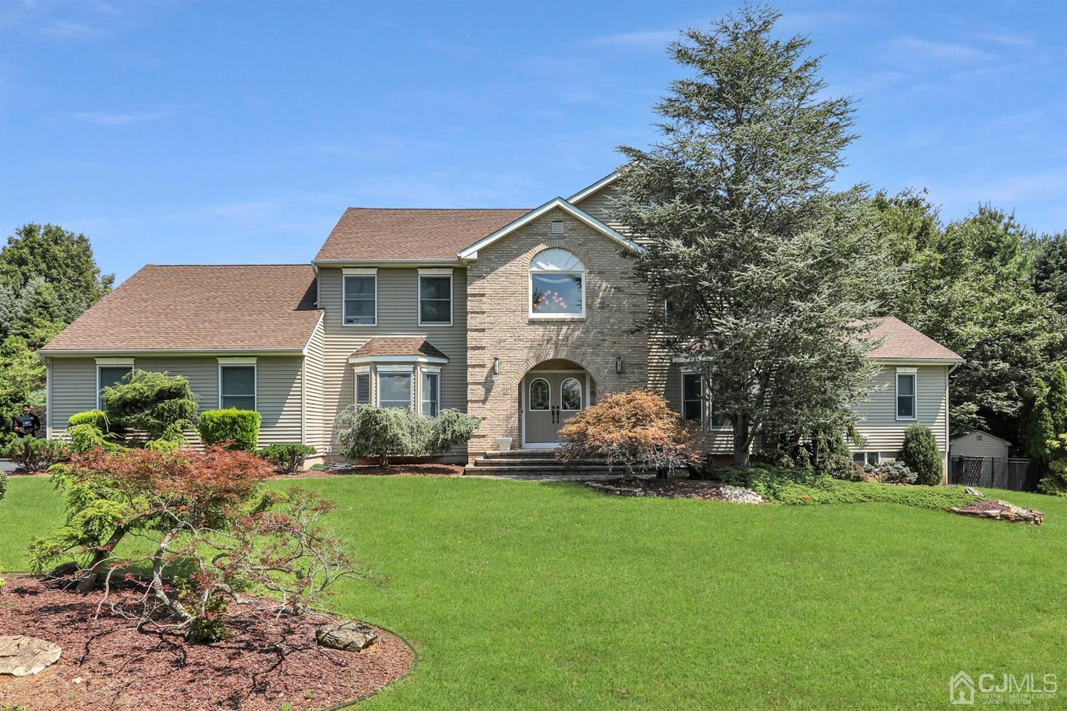 2 Astor Drive Manalapan, NJ 07726 - Photo 2 of 60 a front view of house with yard and green space