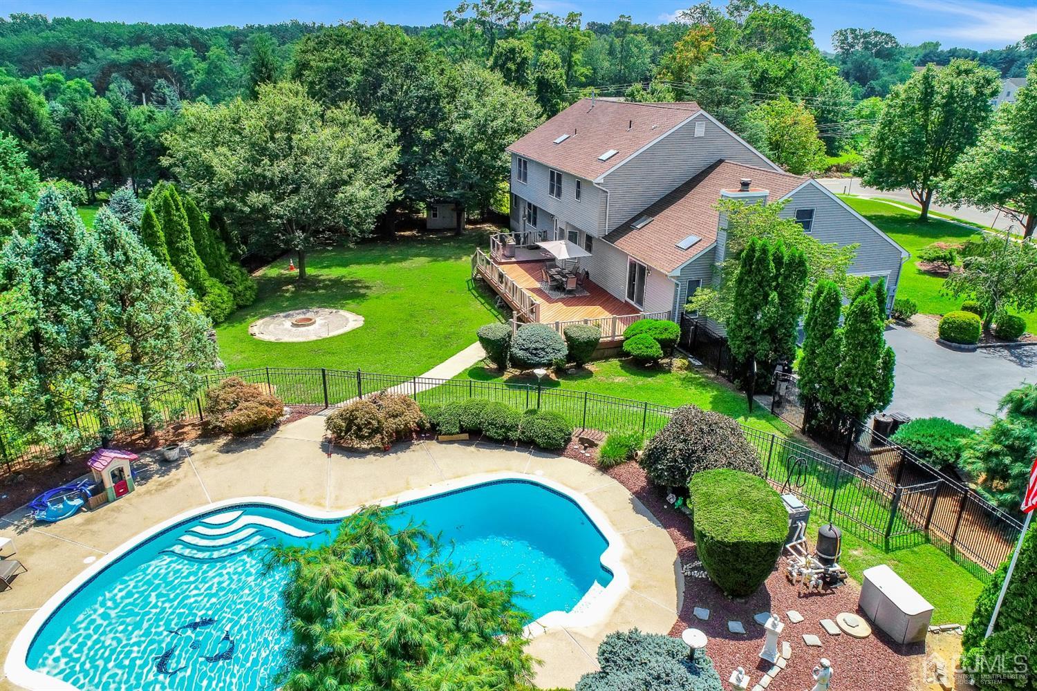 2 Astor Drive Manalapan, NJ 07726 - Photo 12 of 60 an aerial view of a house with yard and green space
