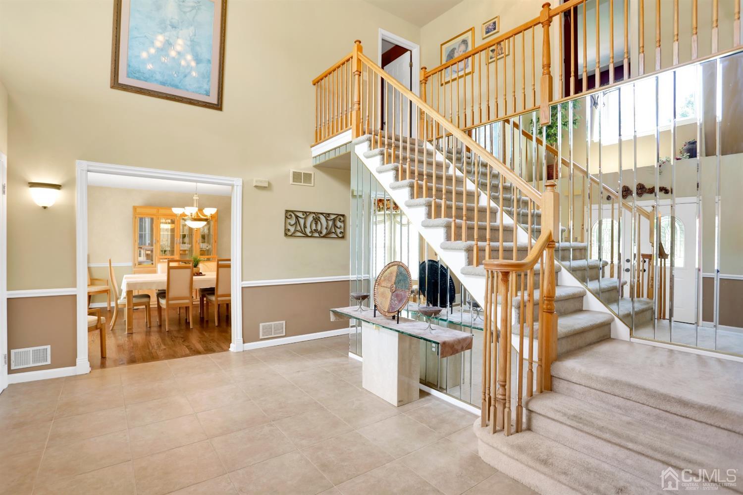 2 Astor Drive Manalapan, NJ 07726 - Photo 23 of 60 a view of entryway livingroom and hall with wooden floor