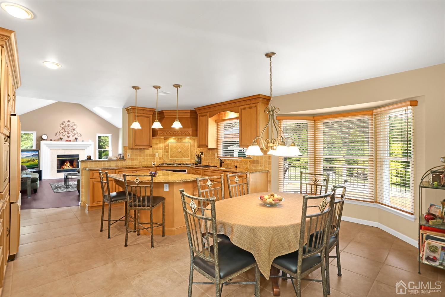 2 Astor Drive Manalapan, NJ 07726 - Photo 24 of 60 a dining room with furniture window and outside view
