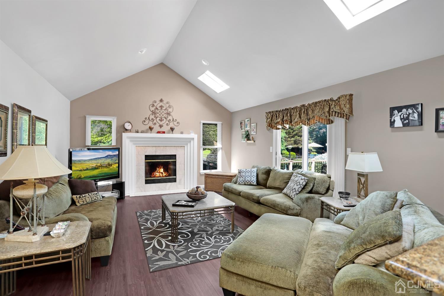 2 Astor Drive Manalapan, NJ 07726 - Photo 28 of 60 a living room with furniture and a fireplace