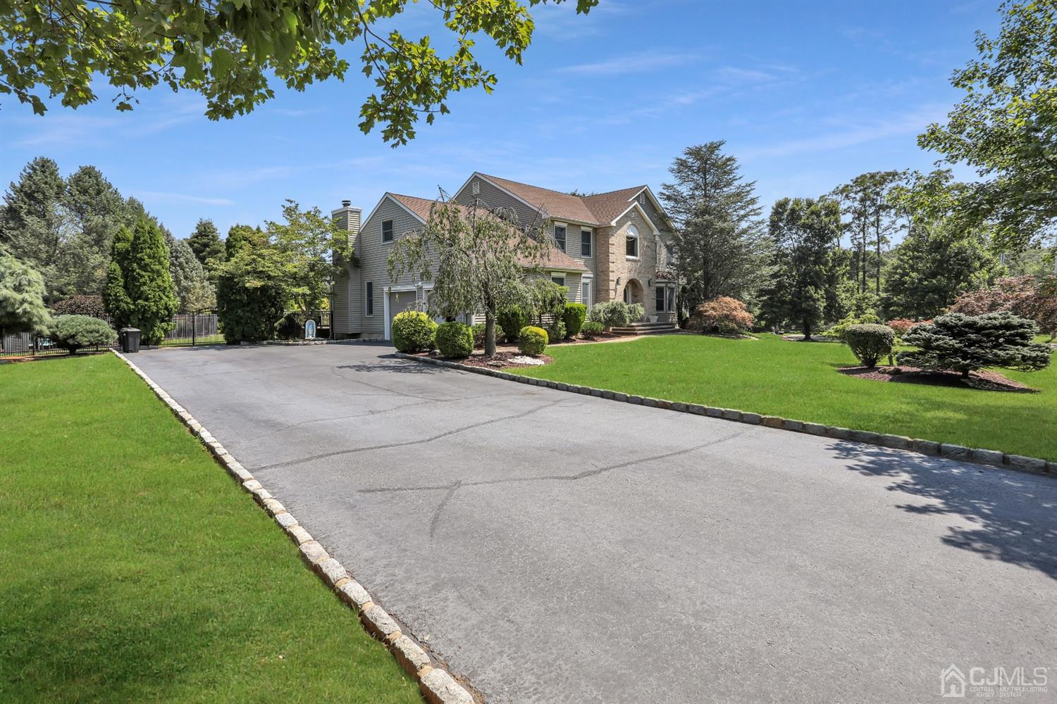 2 Astor Drive Manalapan, NJ 07726 - Photo 4 of 60 a view of a house with a yard