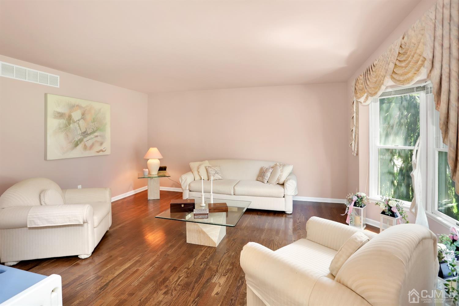 2 Astor Drive Manalapan, NJ 07726 - Photo 32 of 60 a living room with furniture and a large window