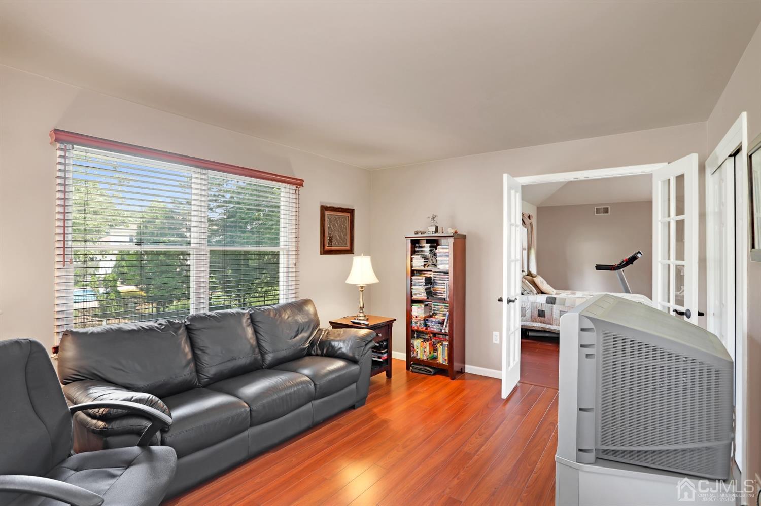 2 Astor Drive Manalapan, NJ 07726 - Photo 34 of 60 a living room with furniture and a large window