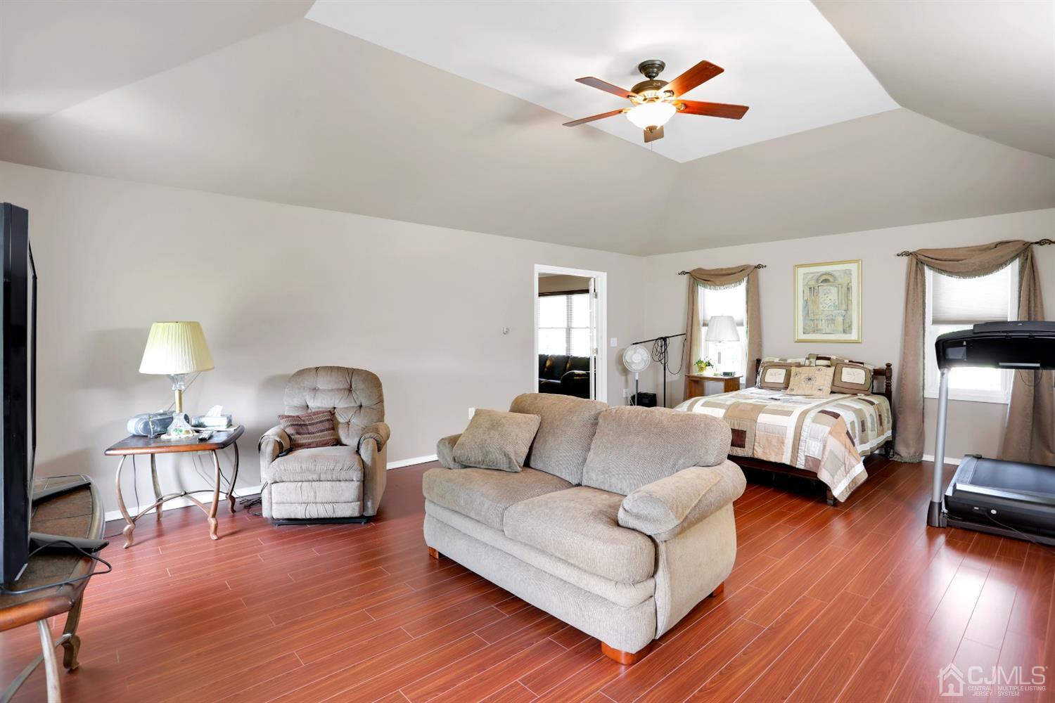 2 Astor Drive Manalapan, NJ 07726 - Photo 35 of 60 a living room with furniture and a wooden floor