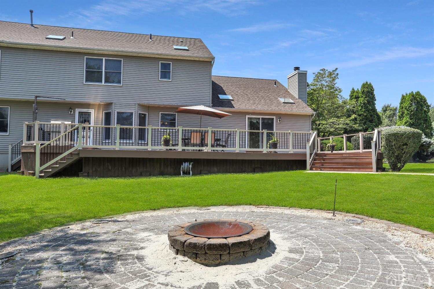 2 Astor Drive Manalapan, NJ 07726 - Photo 41 of 60 a view of a house with a backyard