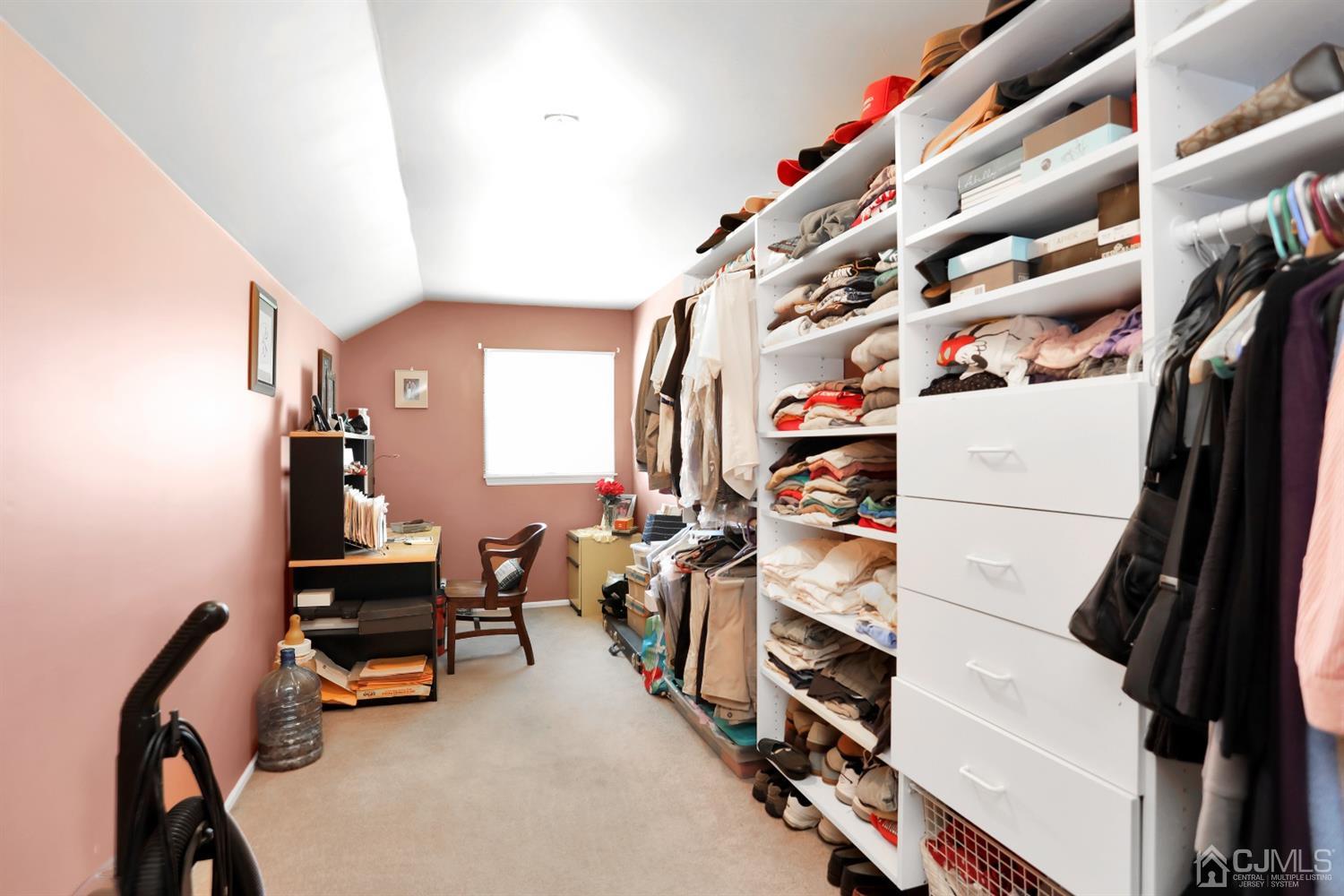 2 Astor Drive Manalapan, NJ 07726 - Photo 48 of 60 walk in closet with clothes and shoes