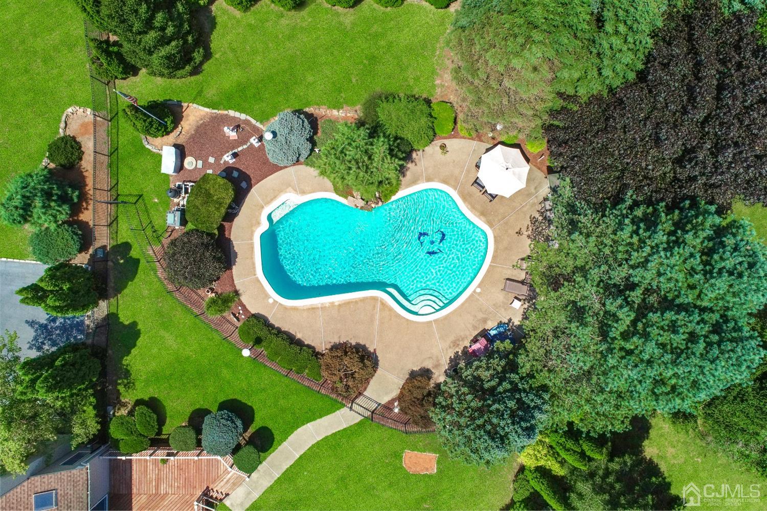 2 Astor Drive Manalapan, NJ 07726 - Photo 56 of 60 an aerial view of a house with swimming pool and outdoor space