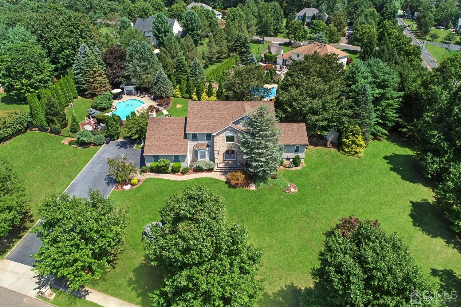 2 Astor Drive Manalapan, NJ 07726 - Photo 59 of 60 an aerial view of residential houses with outdoor space and trees