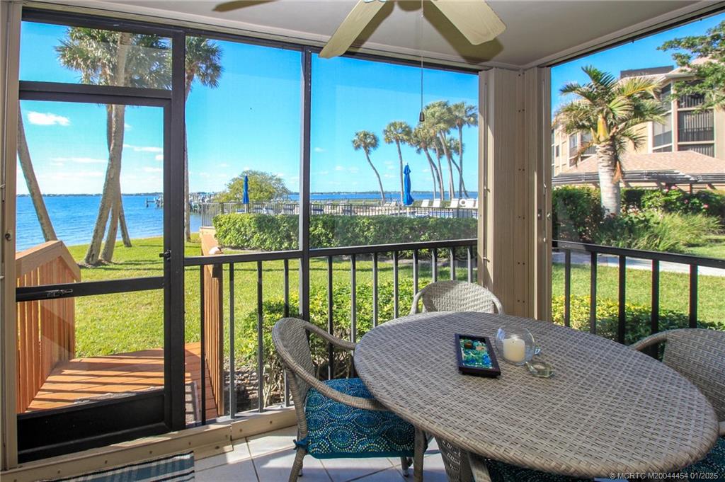 4540 Northeast Sandpebble Trace, Unit 105 Stuart, FL 34996 - Photo 16 of 39 a view of a dining room with furniture window and outside view