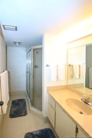 a bathroom with a sink and a shower