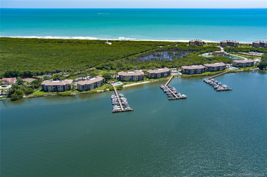 4540 Northeast Sandpebble Trace, Unit 105 Stuart, FL 34996 - Photo 31 of 39 a view of lake view and mountain view