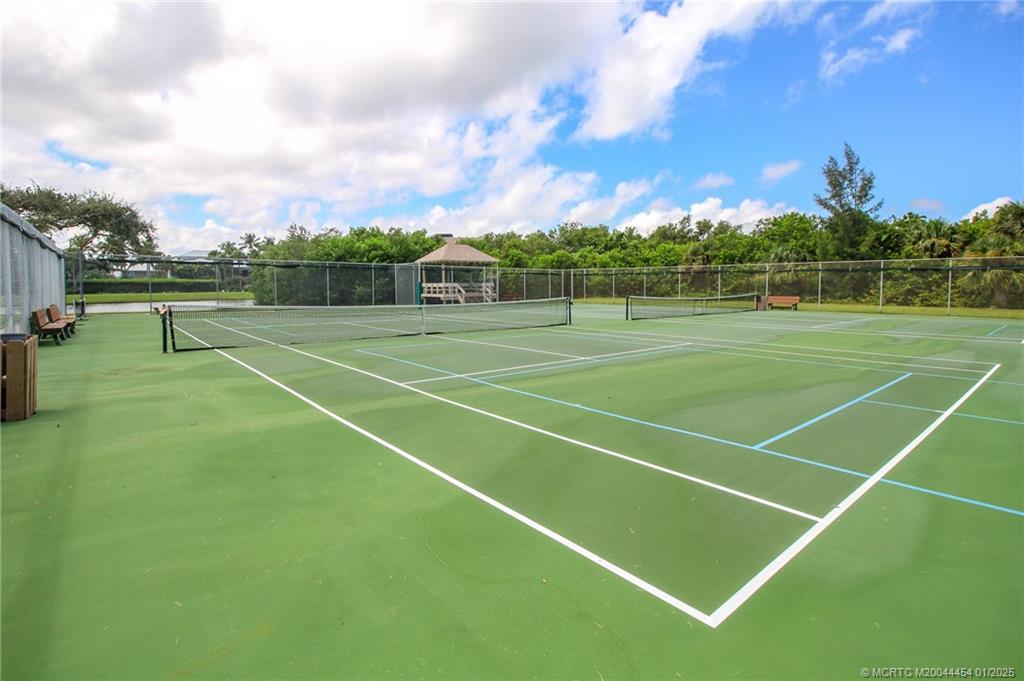 4540 Northeast Sandpebble Trace, Unit 105 Stuart, FL 34996 - Photo 36 of 39 a view of tennis court