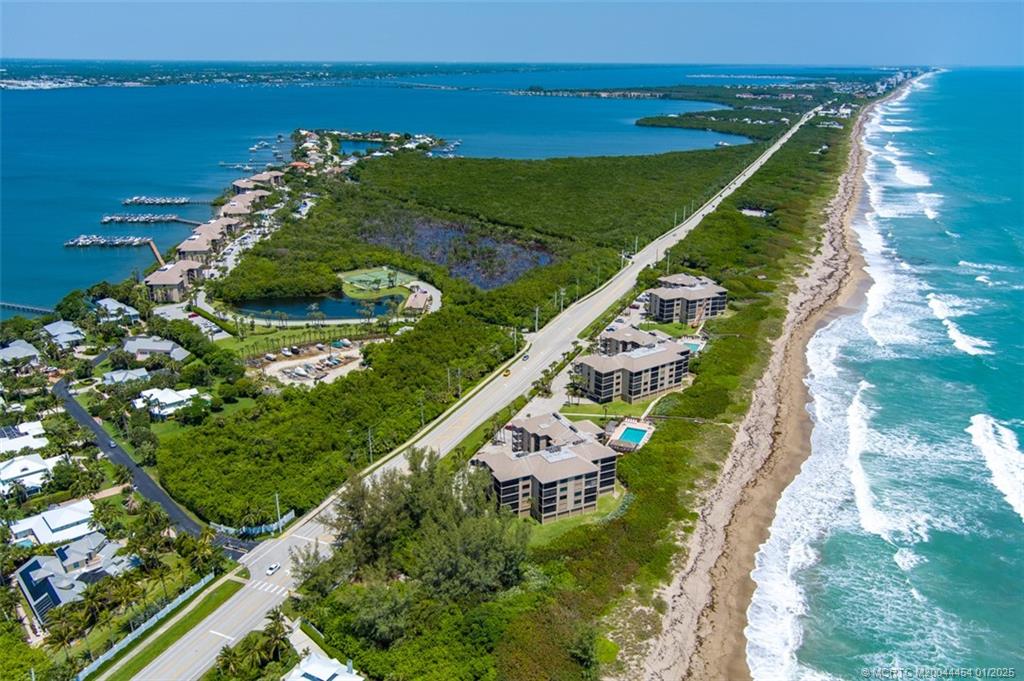4540 Northeast Sandpebble Trace, Unit 105 Stuart, FL 34996 - Photo 39 of 39 a view of building and ocean
