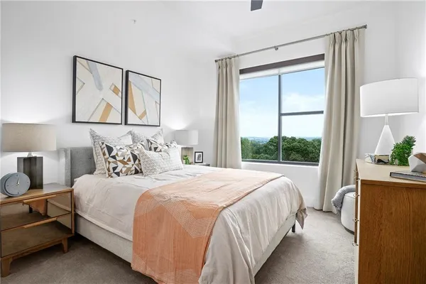 a bedroom with bed and a window