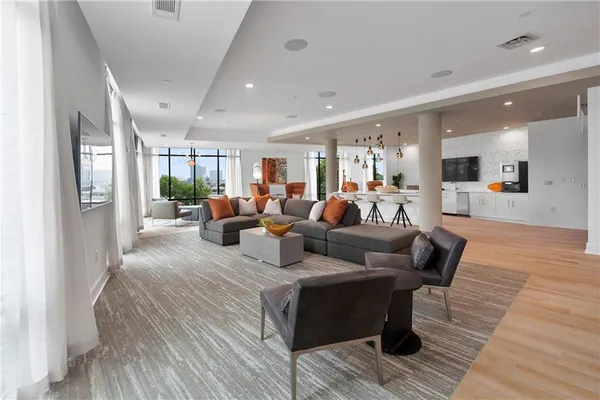 a view of a dining room with furniture and wooden floor